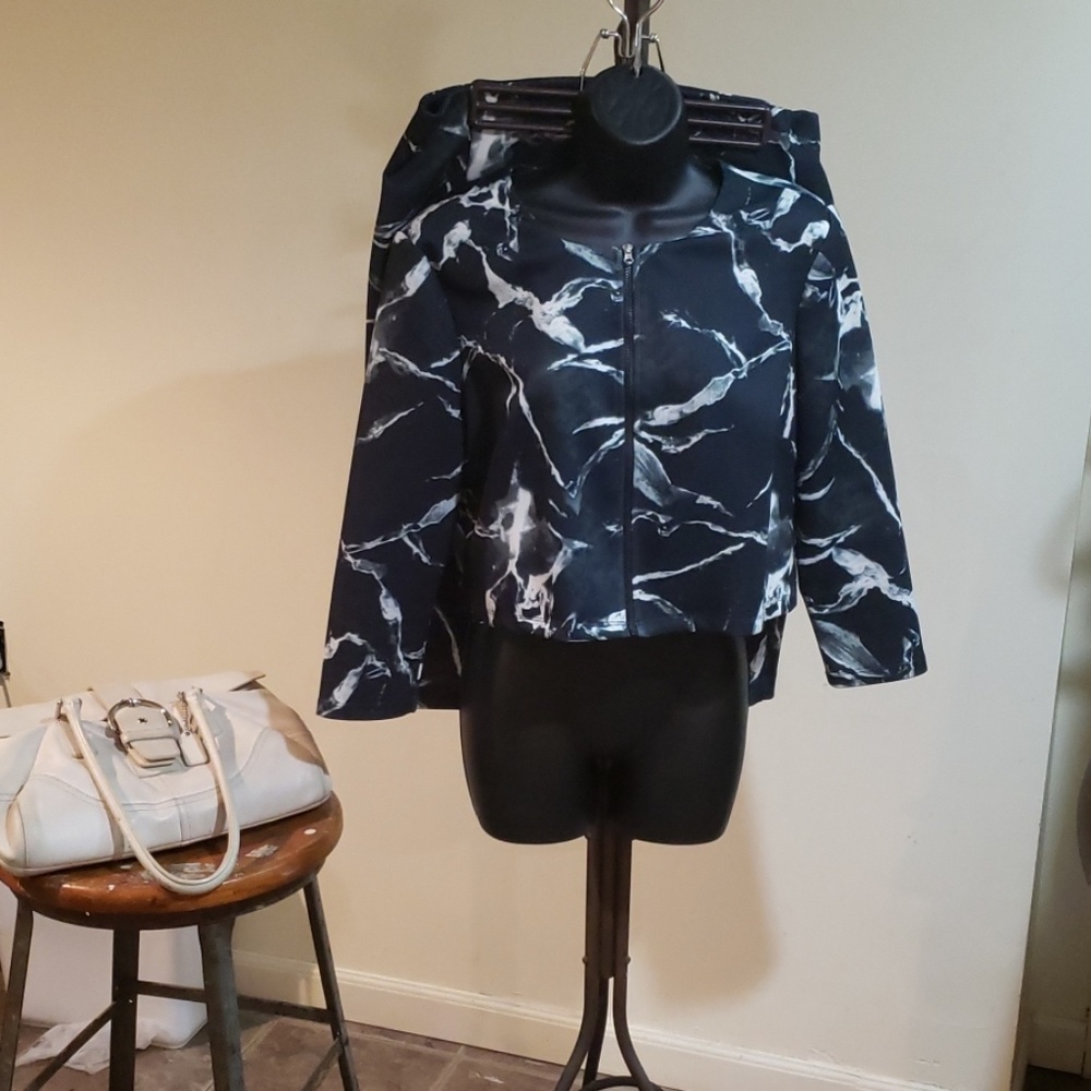 Carmen Marc Valvo suit.